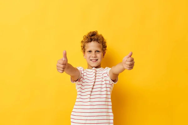 Cheerful Boy in a striped T-shirt gestures with his hands — Stock fotografie