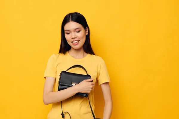 Pretty woman female clutch bag fashion posing isolated background — Stockfoto