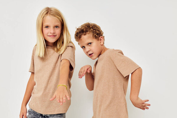 Photo of two children gesticulate with their hands together childhood unaltered