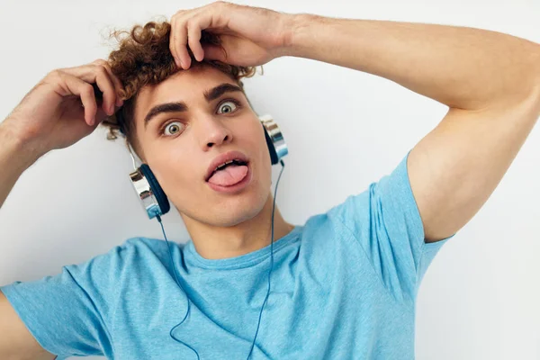 Handsome young man in blue t-shirts headphones fashion Lifestyle unaltered — Stock Photo, Image