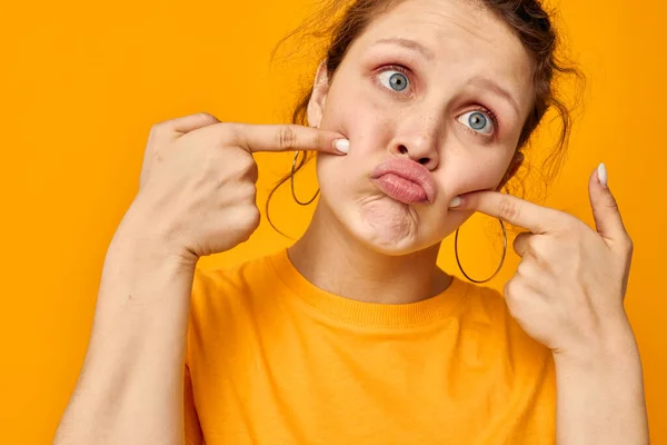 Portrait of a young woman gestures with hands grimace emotions isolated backgrounds unaltered — 图库照片