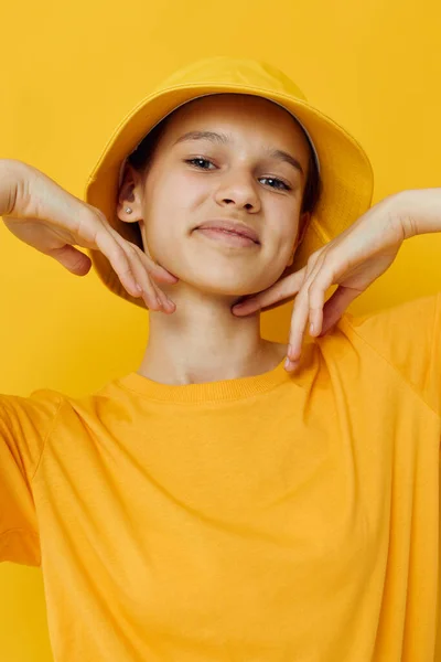 Young woman in a yellow hat Youth style casual wear isolated background — Stock Photo, Image