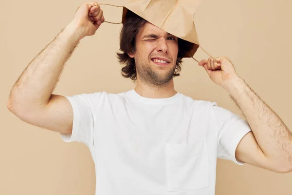 Cheerful man paper bag emotions posing Lifestyle unaltered — Stock fotografie