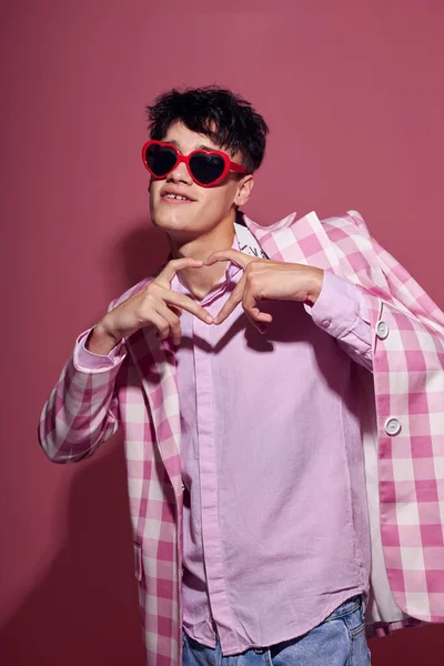 Handsome guy self confidence pink plaid blazer fashion posing pink background unaltered — Stock Fotó