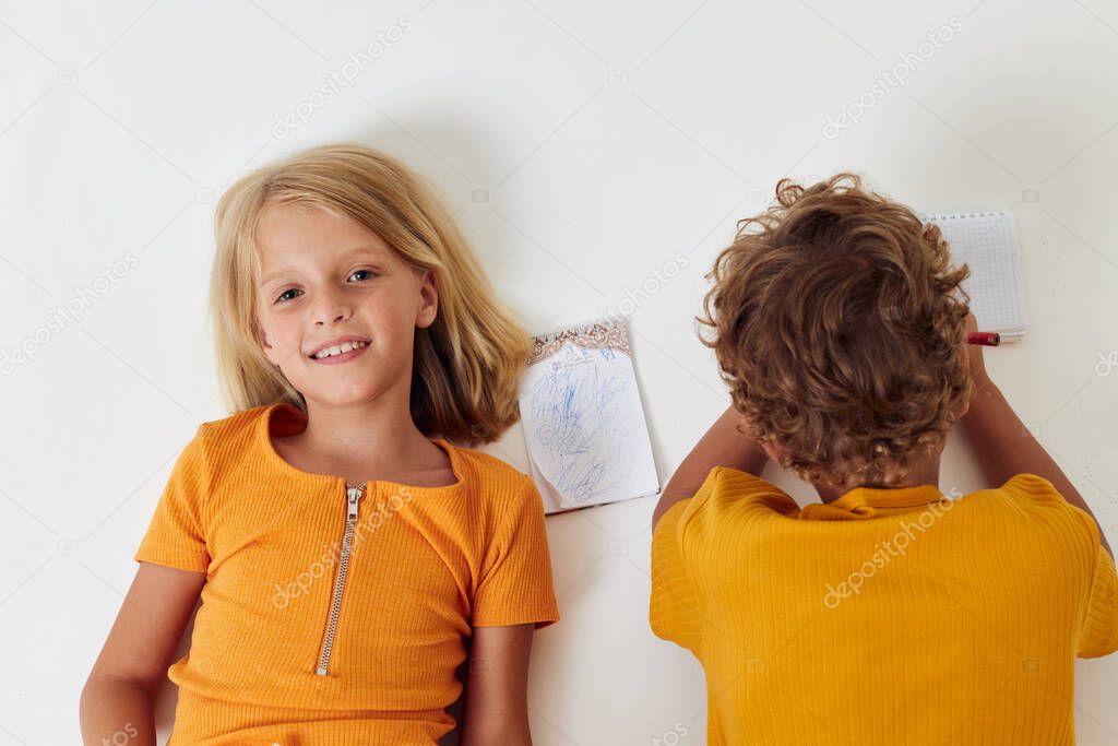 picture of positive boy and girl childhood entertainment drawing isolated background unaltered