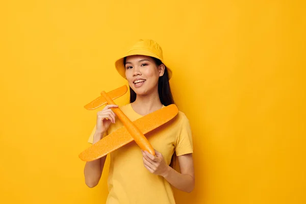 Portrait Asian beautiful young woman cheerful woman with an airplane in the hands of fun Monochrome shot — 图库照片