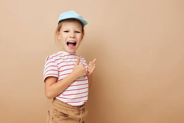 Portrait of happy smiling child girl posing baby clothes fun Lifestyle unaltered — Stockfoto