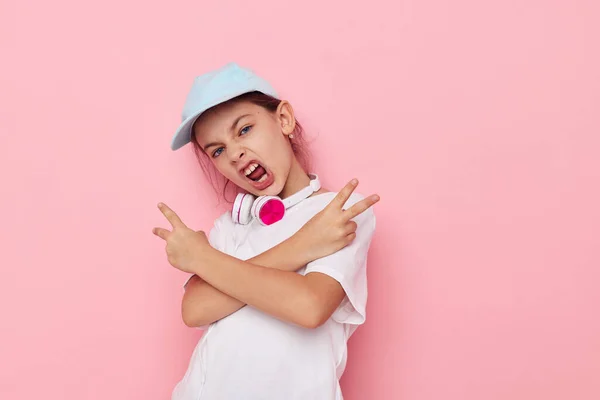 Portrait of happy smiling child girl listening to music on headphones Lifestyle unaltered — 图库照片