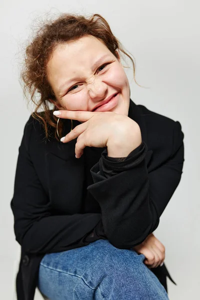 Portrait of a young woman elegant style black blazer posing light background unaltered — Stock Photo, Image