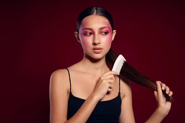 stock image woman combing hair hairstyle care close-up