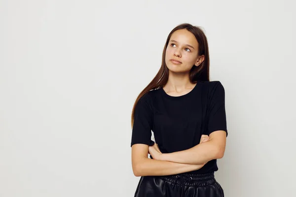 Athletic woman in a black t-shirt hand gesture fun isolated background — Stockfoto