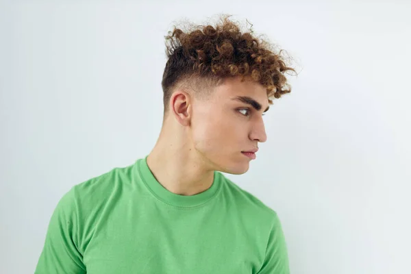 Handsome young man in green t-shirts emotions posing Lifestyle unaltered — Stock Photo, Image