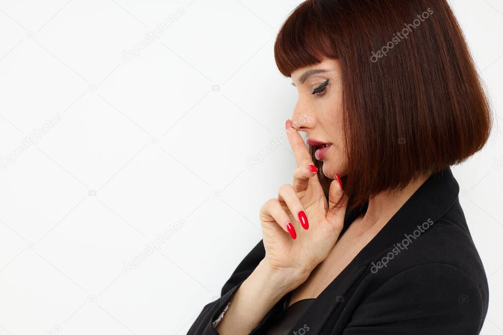 beautiful woman in a black jacket red nail polish posing Lifestyle unaltered