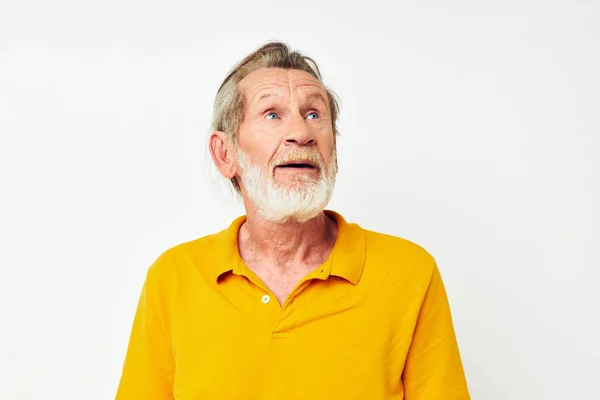 Senior grey-haired man with a gray beard emotion gestures hands cropped view — Stock Photo, Image