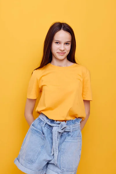 Optimistic young woman fashion in yellow t-shirt denim shorts Lifestyle unaltered — Stock Photo, Image