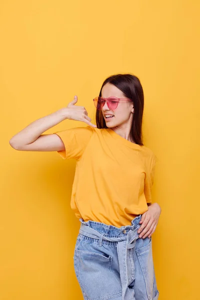 Young beautiful woman in a yellow t-shirt emotions summer style isolated background — Stock Photo, Image