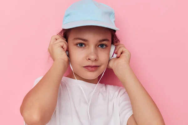 Portrait of happy smiling child girl listening to music on headphones Lifestyle unaltered — Stock Photo, Image