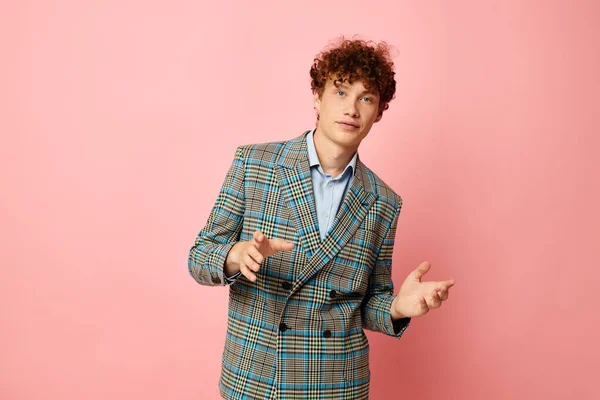 stock image portrait of a young curly man in a suit business look posing emotions isolated background unaltered