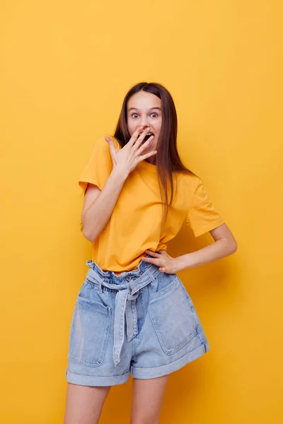 Photo pretty girl in a yellow t-shirt emotions summer style isolated background — Stock Photo, Image