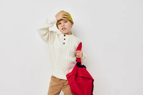 Little girl school red backpack posing isolated background — Stock fotografie