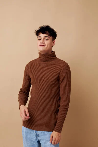 A young man stylish hairstyle brown turtleneck isolated background unaltered — Stock Photo, Image