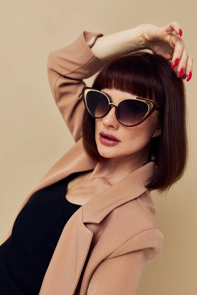 portrait of a woman Charm red nails model luxury sunglasses light background