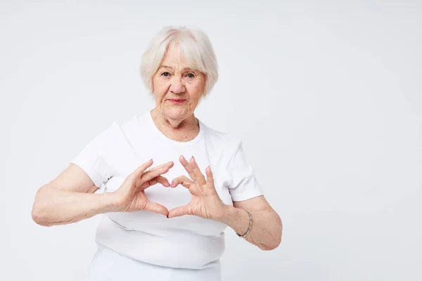 Ritratto di una donna anziana amichevole stile di vita di salute sfondo leggero Immagine Stock