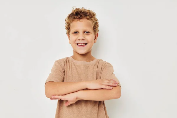 Cute little boy on a light background posing smile — Stock fotografie