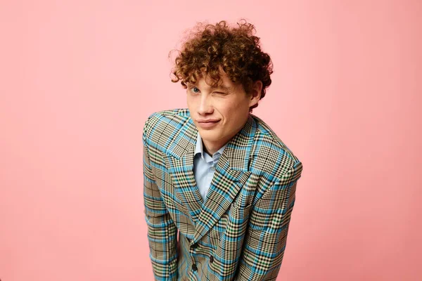Young curly-haired man gesturing with his hands emotions checkered jacket Lifestyle unaltered — Fotografia de Stock