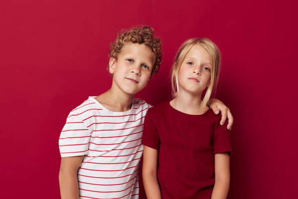 picture of positive boy and girl fun childhood entertainment on colored background