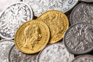 Austro-Hungarian Empire or the Dual Monarchy Gold coins - Close up.Old gold and silver Austrian coins of the 19th century.coin showing austrian emperor Franz Joseph, clipart