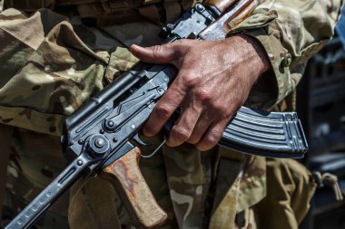 Hands and chests of soldiers in uniforms with machine guns.mashine gun ak - 47 - kalashnikov