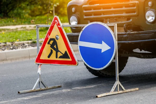 Road signs!Road works with trucks and traffic signs.road works road blocked signs and traffic cones diversion access only;Barriers and road signs.