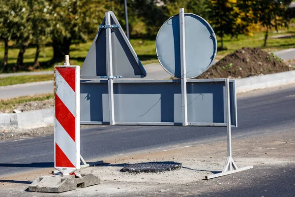 Road signs!Road works with trucks and traffic signs.road works road blocked signs and traffic cones diversion access only;Barriers and road signs.