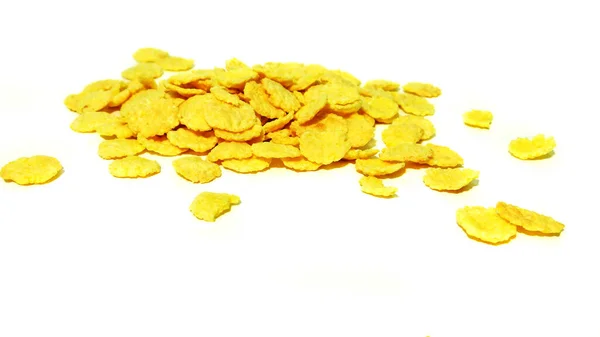 Beyaz arkaplanda sarı gevrek tanecikler