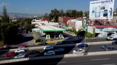 Naucalpan, Mexico - March 2022 The British Petroleum gas station is observed next to the main peripheral highway. It is possible to observe traffic caused by traffic jams.
