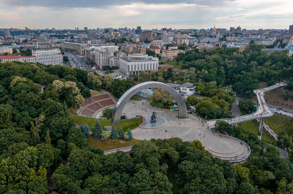 Sunset over summer Kiev with Arch of Friendship of Peoples.