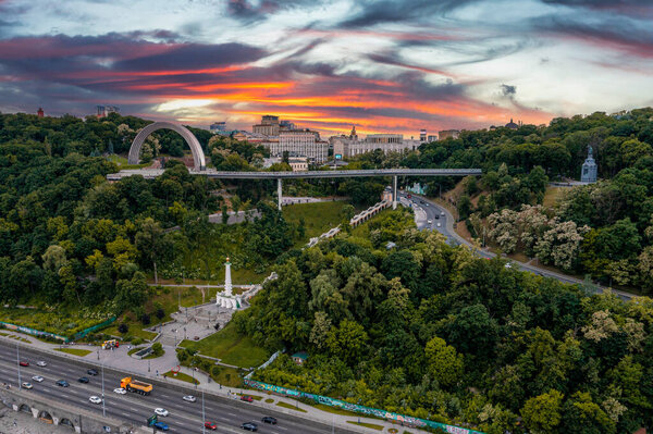 Sunset over summer Kiev with Arch of Friendship of Peoples.