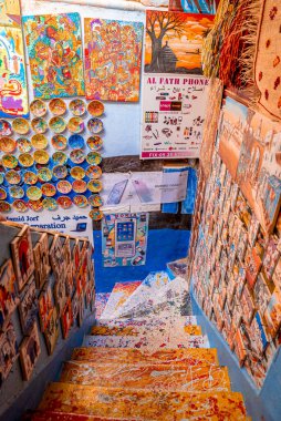 Colorful picture frame and plates on wall at local bazaar