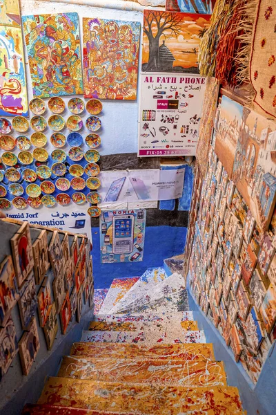 Colorful picture frame and plates on wall at local bazaar