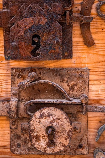 Old fashioned vintage style rustic keyholes on wooden door — Photo