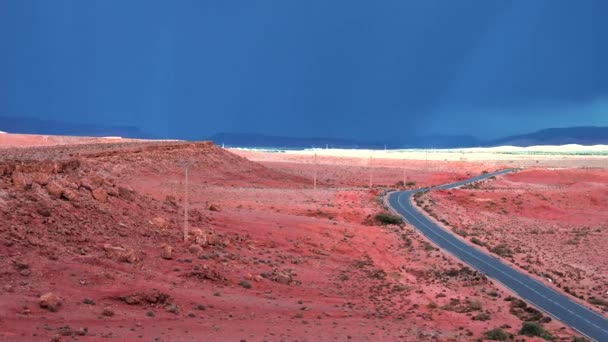 Scenic view of highway through desert against dramatic sky in summer — Video Stock