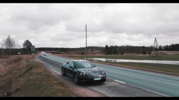 Aerial Drone Shot Porsche Taycan Electric Sport Car Driving Highway — Stock Video