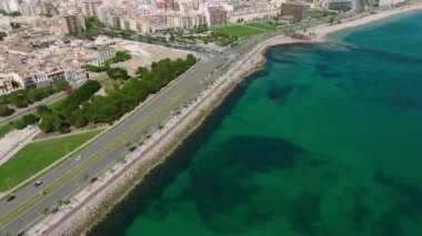 Aerial view of the highway near Palma de Mallorca and the beach in Spain. Road goes into the capital.