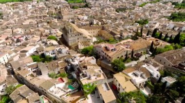 Aerial view of Pollenca, Mallorca, Spain. Small town with a view into a green and rocky landscape.