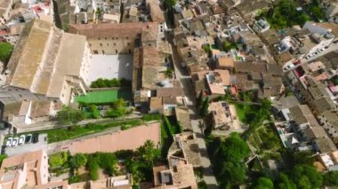 Aerial view of Pollenca, Mallorca, Spain. Small town with a view into a green and rocky landscape.