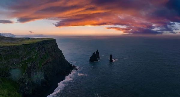 Iceland black sand beach with huge waves at Reynisfjara Vik. Aerial cinematic 4k video. Beautiful Iceland nature coastline from above.