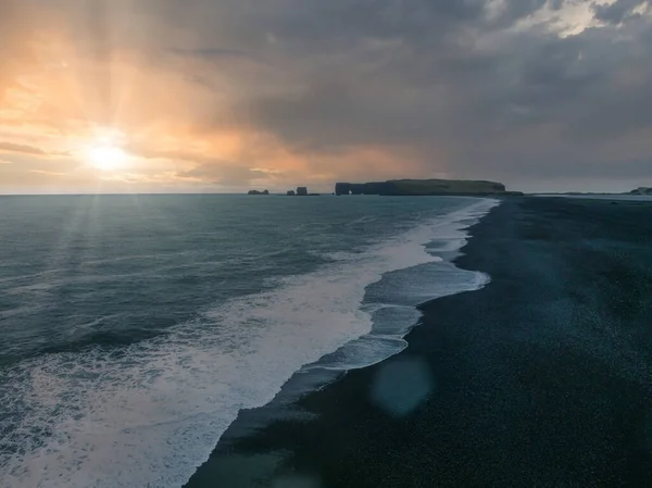 Iceland black sand beach with huge waves at Reynisfjara Vik. Aerial cinematic 4k video. Beautiful Iceland nature coastline from above.