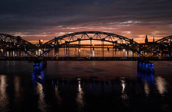 Aerial view of the train bridge in Riga, Latvia during beautiful summer sunset.