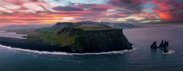 Iceland black sand beach with huge waves at Reynisfjara Vik. Aerial cinematic 4k video. Beautiful Iceland nature coastline from above.